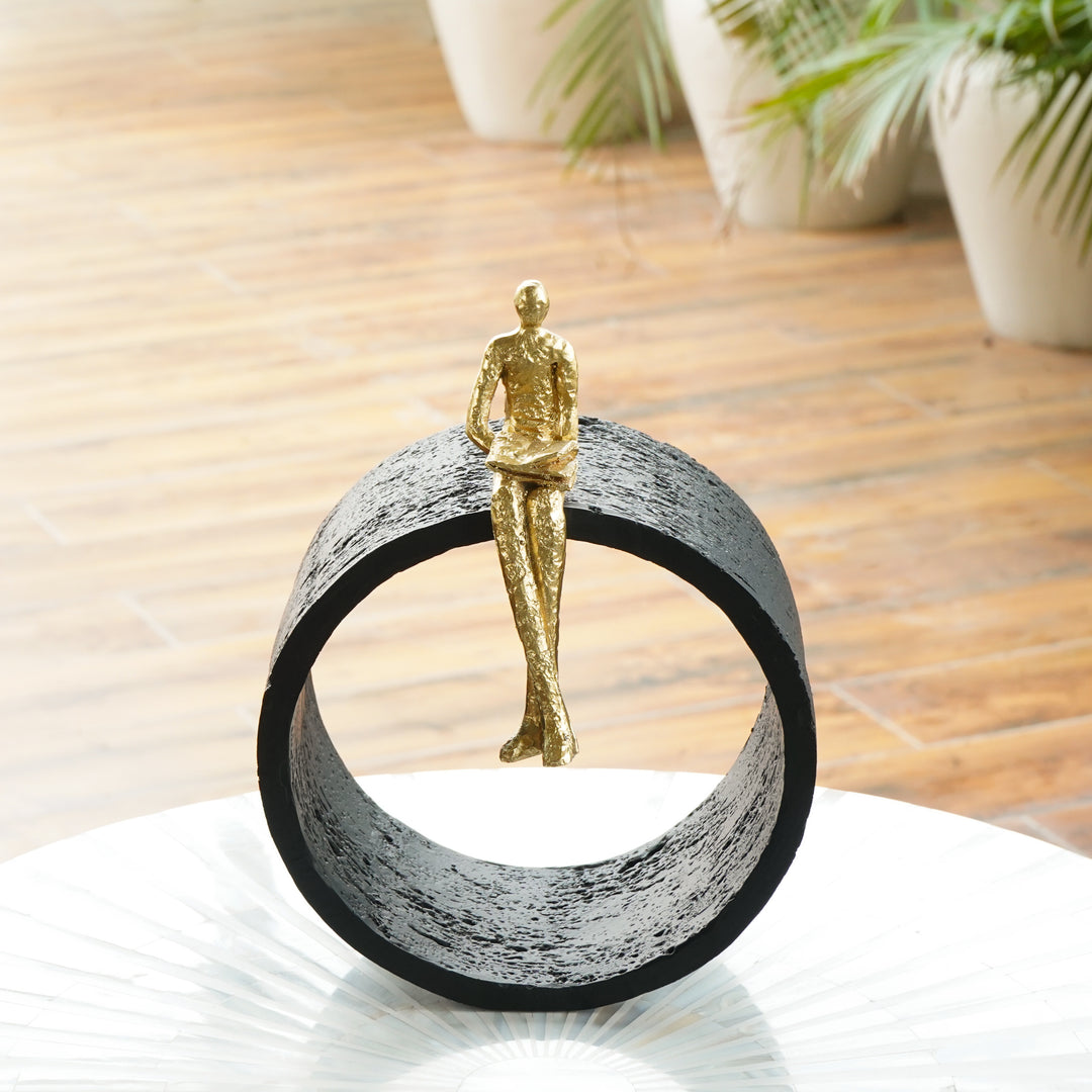 Black & Gold Circular Focused Sitting Figure Sculpture