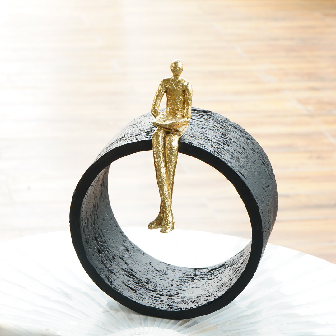 Black & Gold Circular Focused Sitting Figure Sculpture