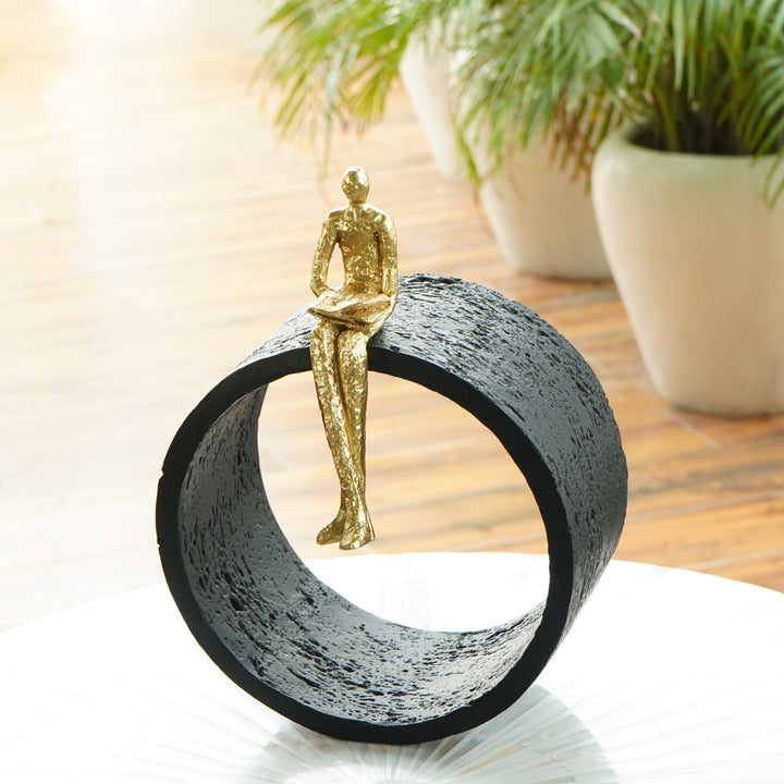 Black & Gold Circular Focused Sitting Figure Sculpture