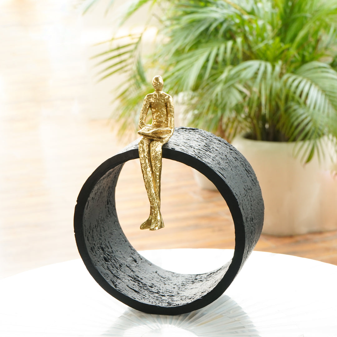 Black & Gold Circular Focused Sitting Figure Sculpture